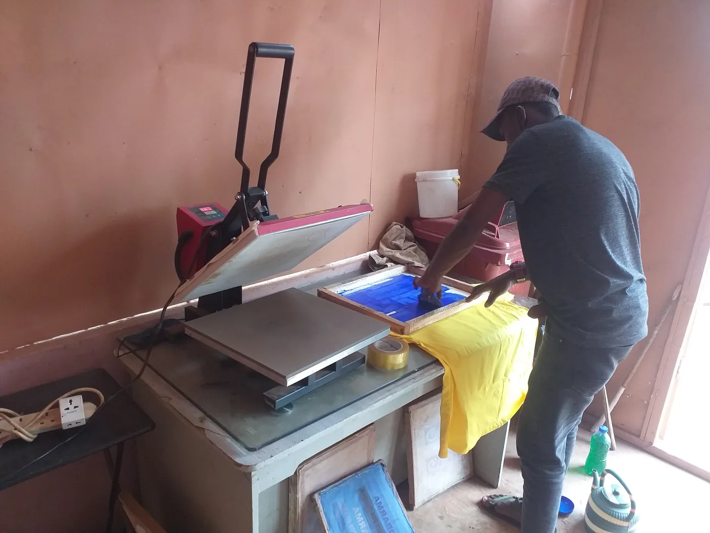 Custom shirt printing process at a heat press